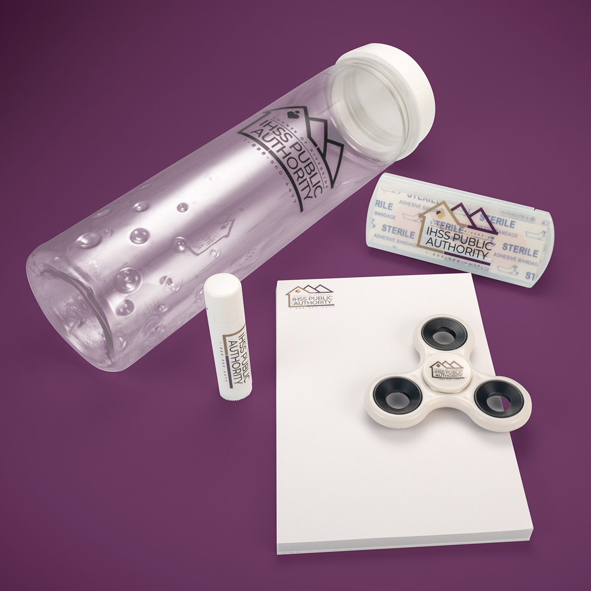 Promo Items: Water Bottle, Notepad, Lip Balm, Bandages & Fidget Spinner